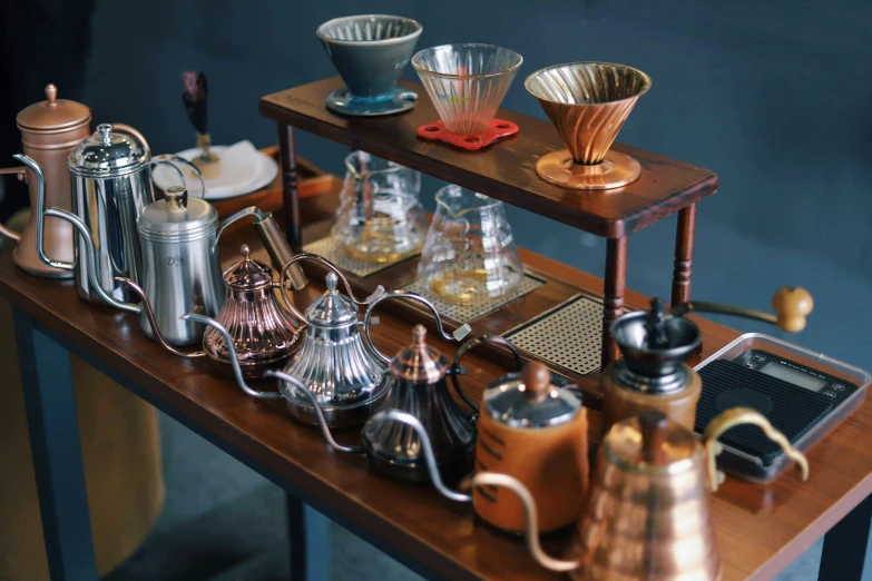 various glass items on a display shelf and coffee mugs