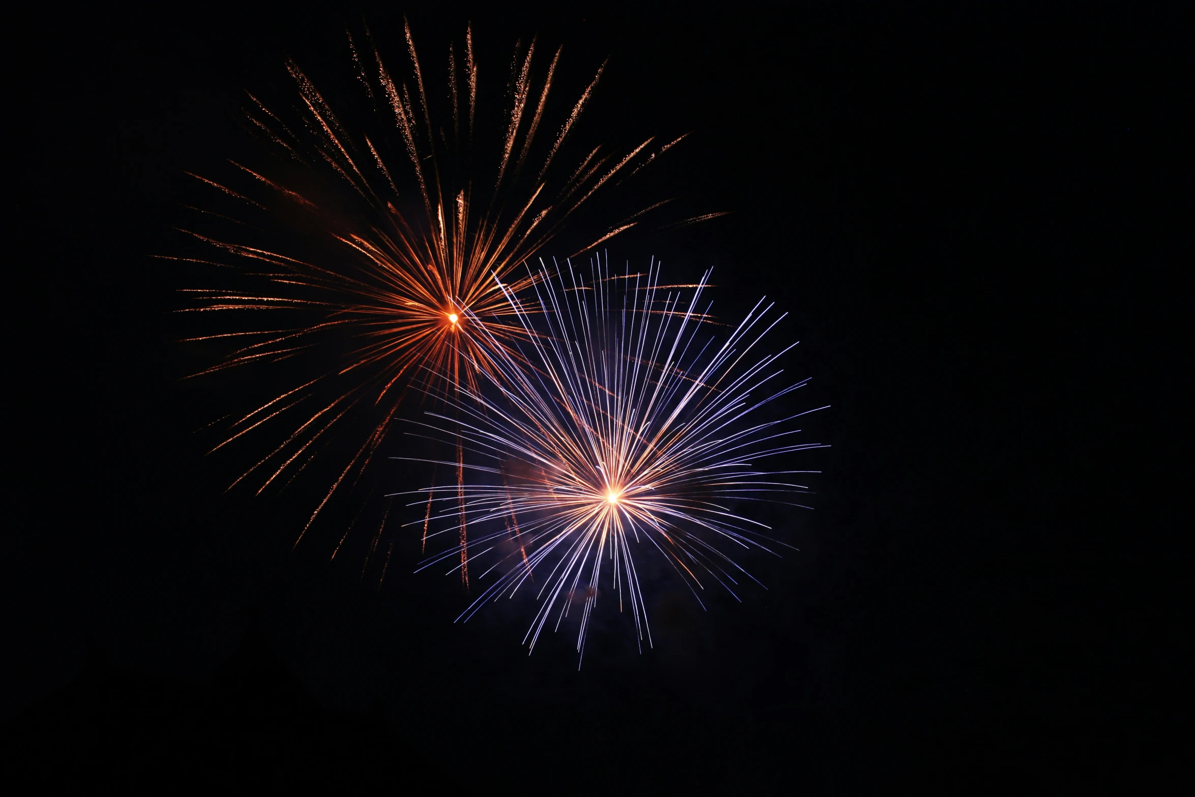 a large display of brightly colored fireworks against a dark background