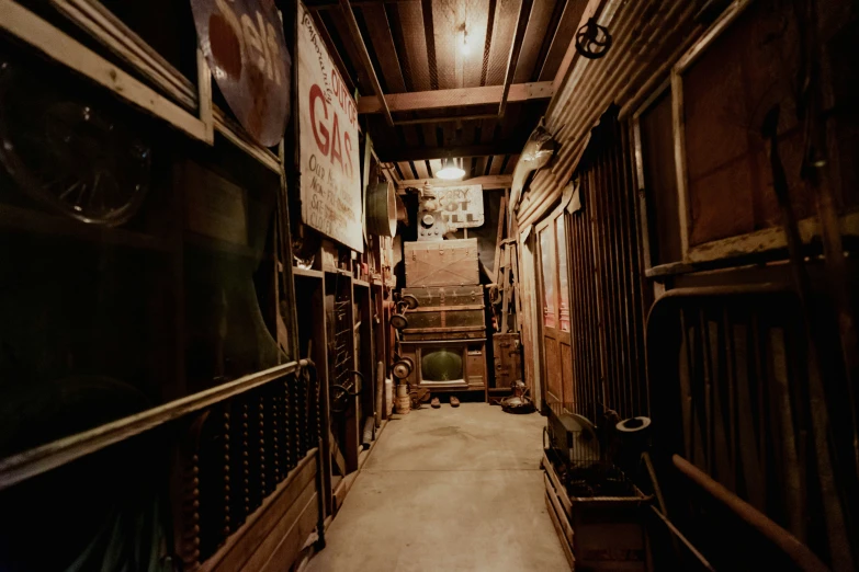 a long narrow street has signs and cabinets