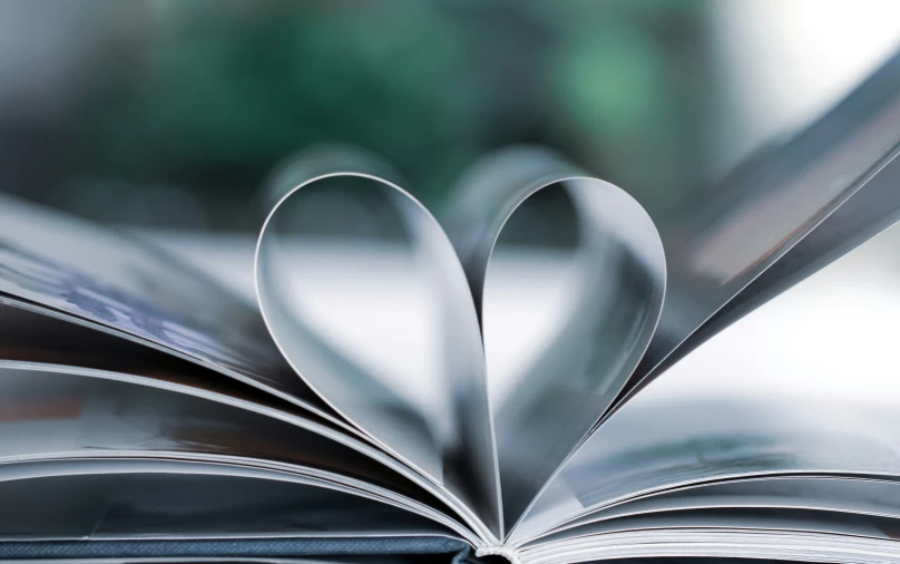 open book with pages shaped like heart