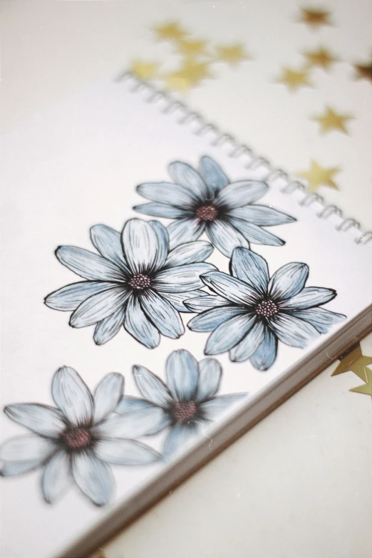 this is a spiral page with flowers on it