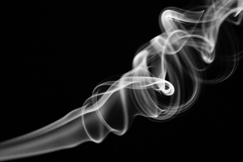 smoke is shown on the black background in this image