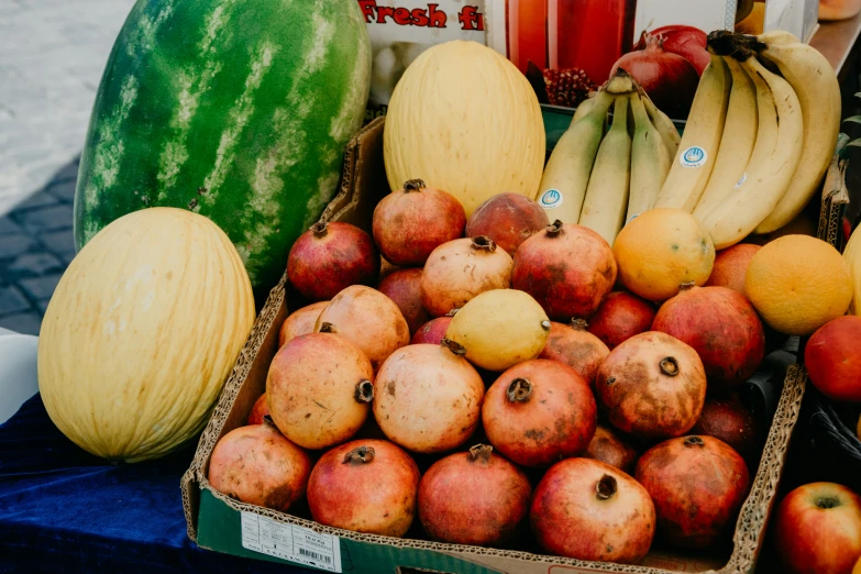 a large assortment of fruit is displayed in baskets