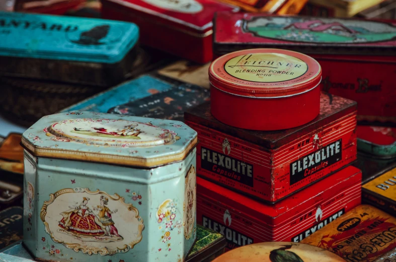 an assortment of metal tins stacked together