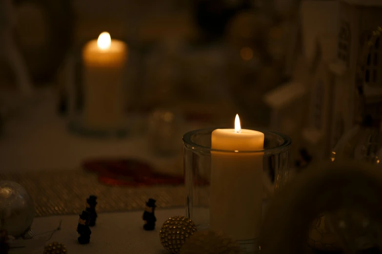 a candle is lit on top of a table