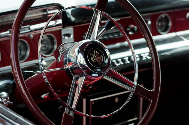 an image of an old fashioned steering wheel and car dash board