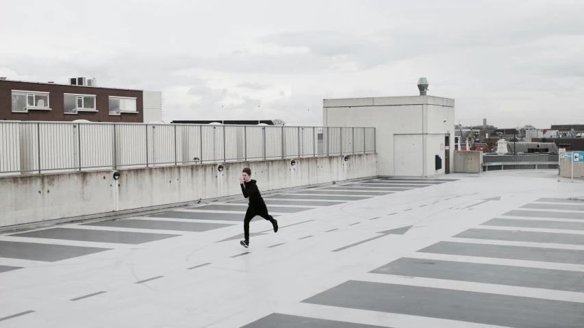 a person doing tricks on the roof in a city