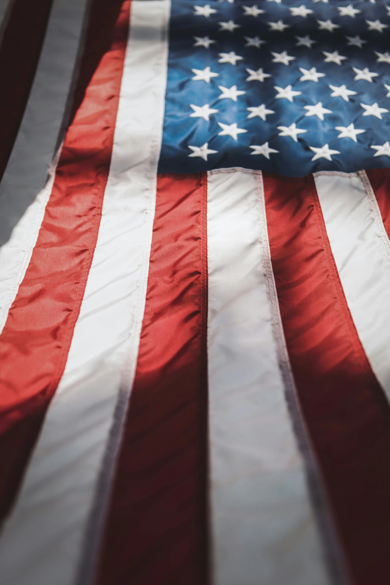 the american flag is on display in a display case