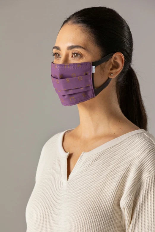 the purple face mask is a cloth face covering for ventilation and movement