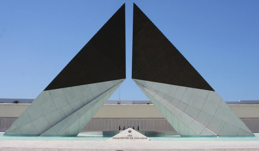 a sculpture of a very large sail on top of a building