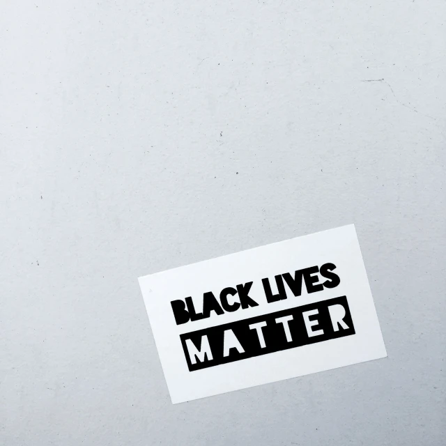 a black lives matter sticker is displayed on a white background