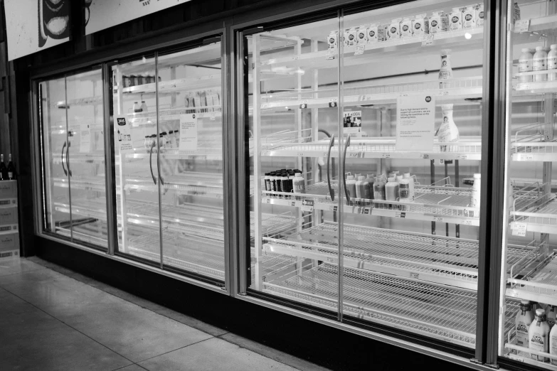 empty storefront display with glass doors and large window display