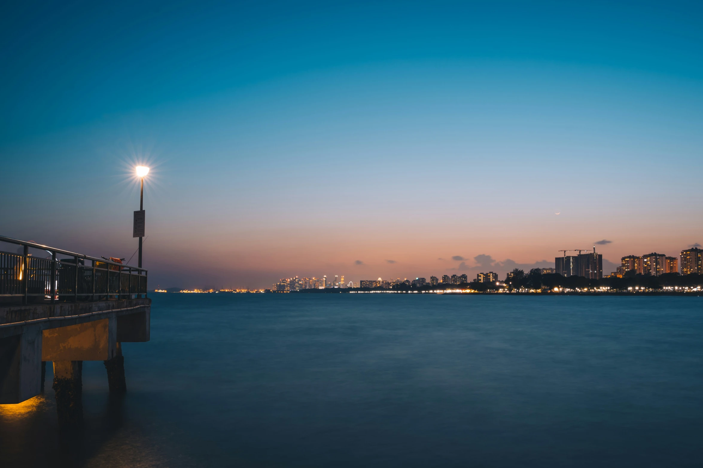 view of lights in the distance with city skyline