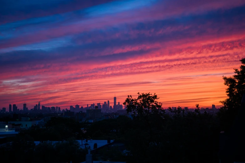 the sky is lit up at sunrise in an area that looks great