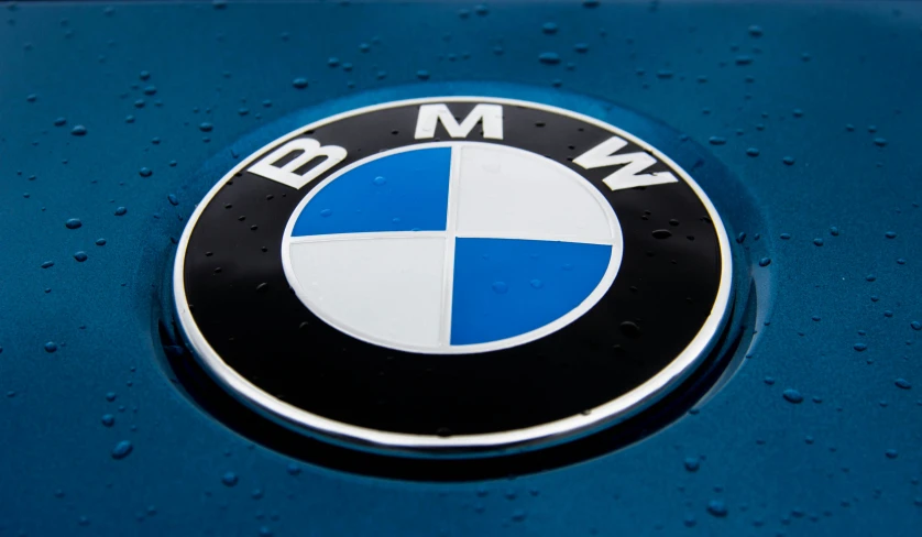 blue bmw logo that is sitting on the surface