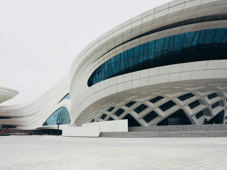 a huge building with stairs and large windows