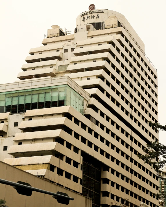 a large white and green building with two clocks on the top of it