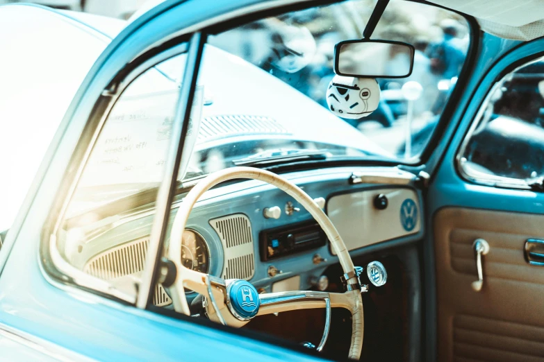 a car dashboard with a steering wheel and dash light