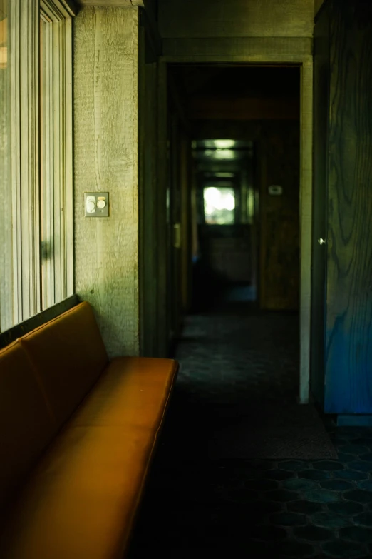 the hallway is made up with wooden panels and windows