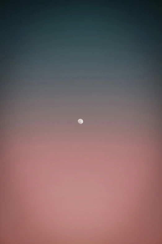 a full view of a dark blue sky with some pink and white