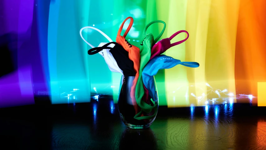 this is a pograph of a colorful vase filled with items