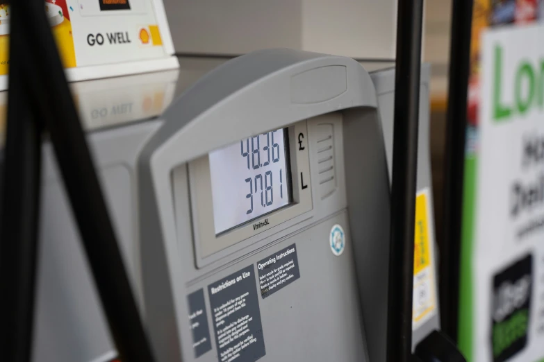 gas pumps filled with fuel and nozzles