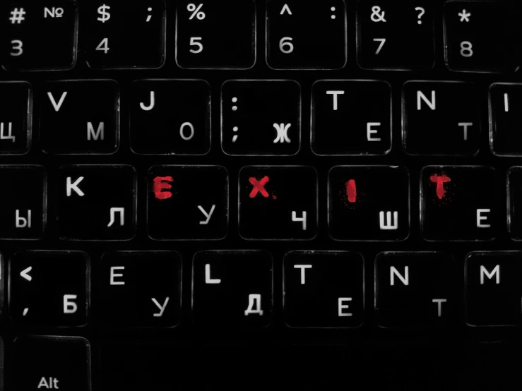 a black keyboard with red lettering that says, let me know what you are