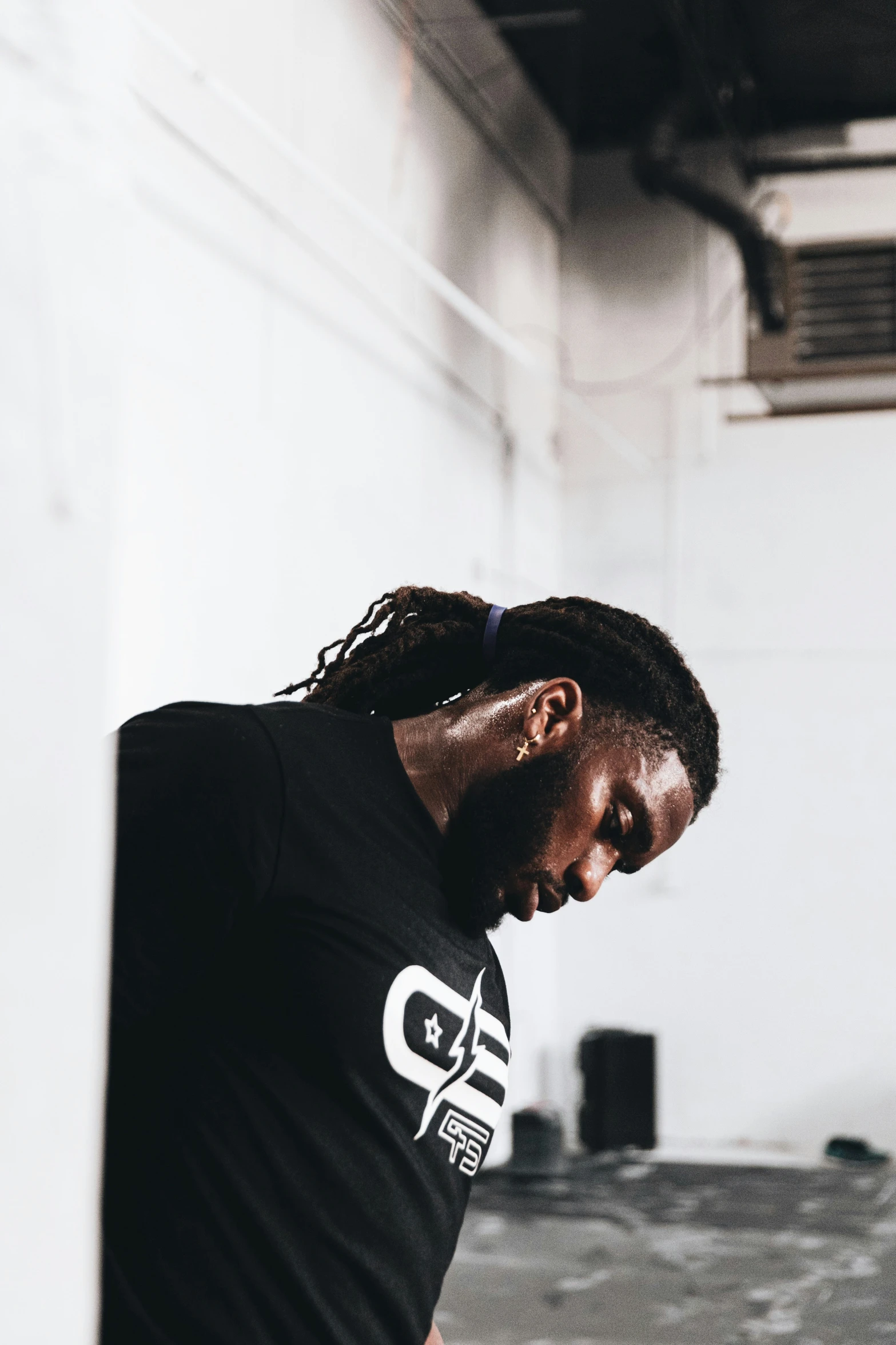 a young man in a t - shirt poses for a pograph