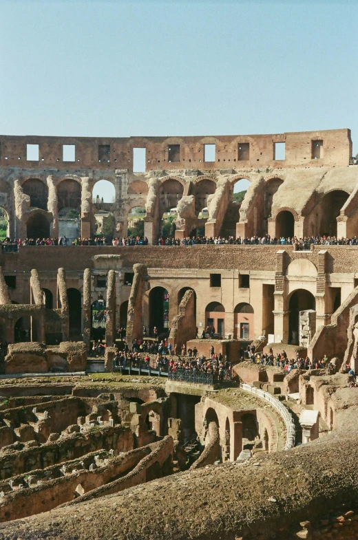 the interior of an ancient building with many people