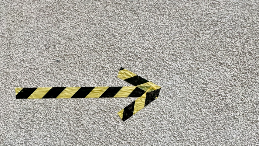 a traffic sign is standing in the middle of a sidewalk