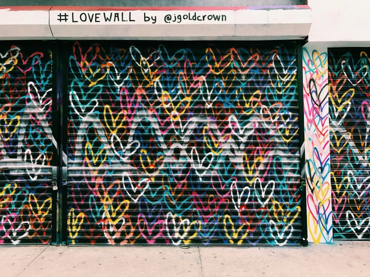 an outside view of a store with graffiti on it