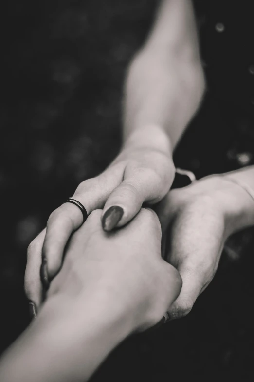 couple touching hands and rings for marriage day