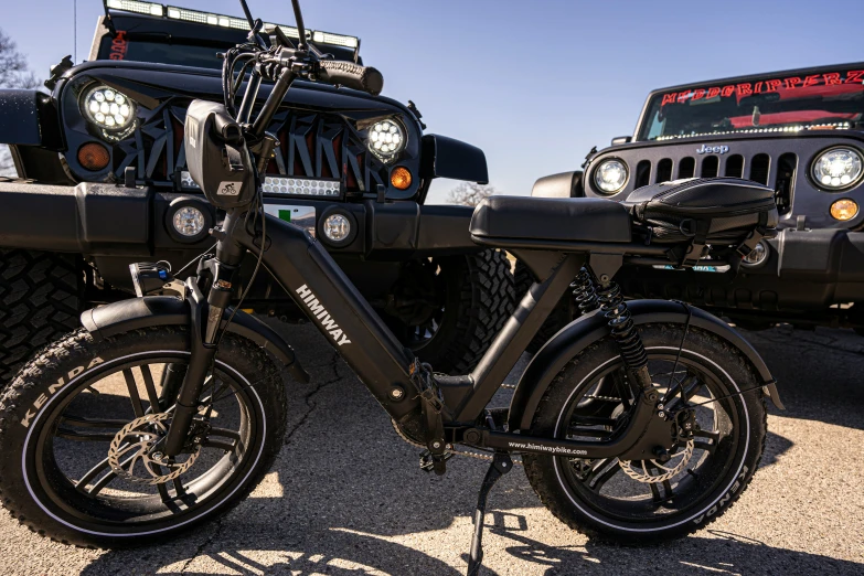 a motor scooter parked beside another moped