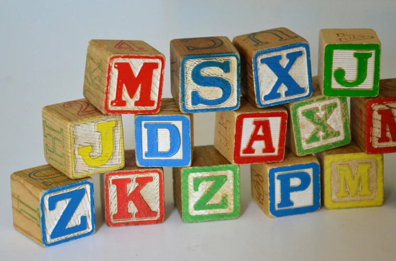 multiple blocks stacked up together in the shape of letters