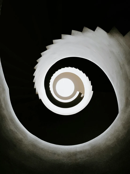 a stairway with circular stairs in the center