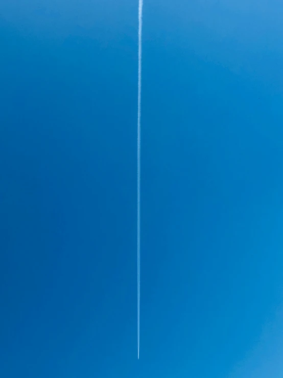 two airplanes flying side by side in the sky