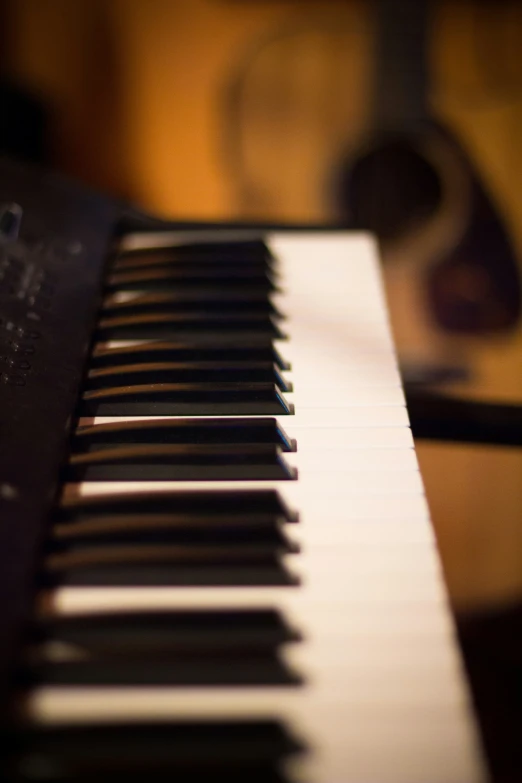 piano keys sitting on top of a music keyboard