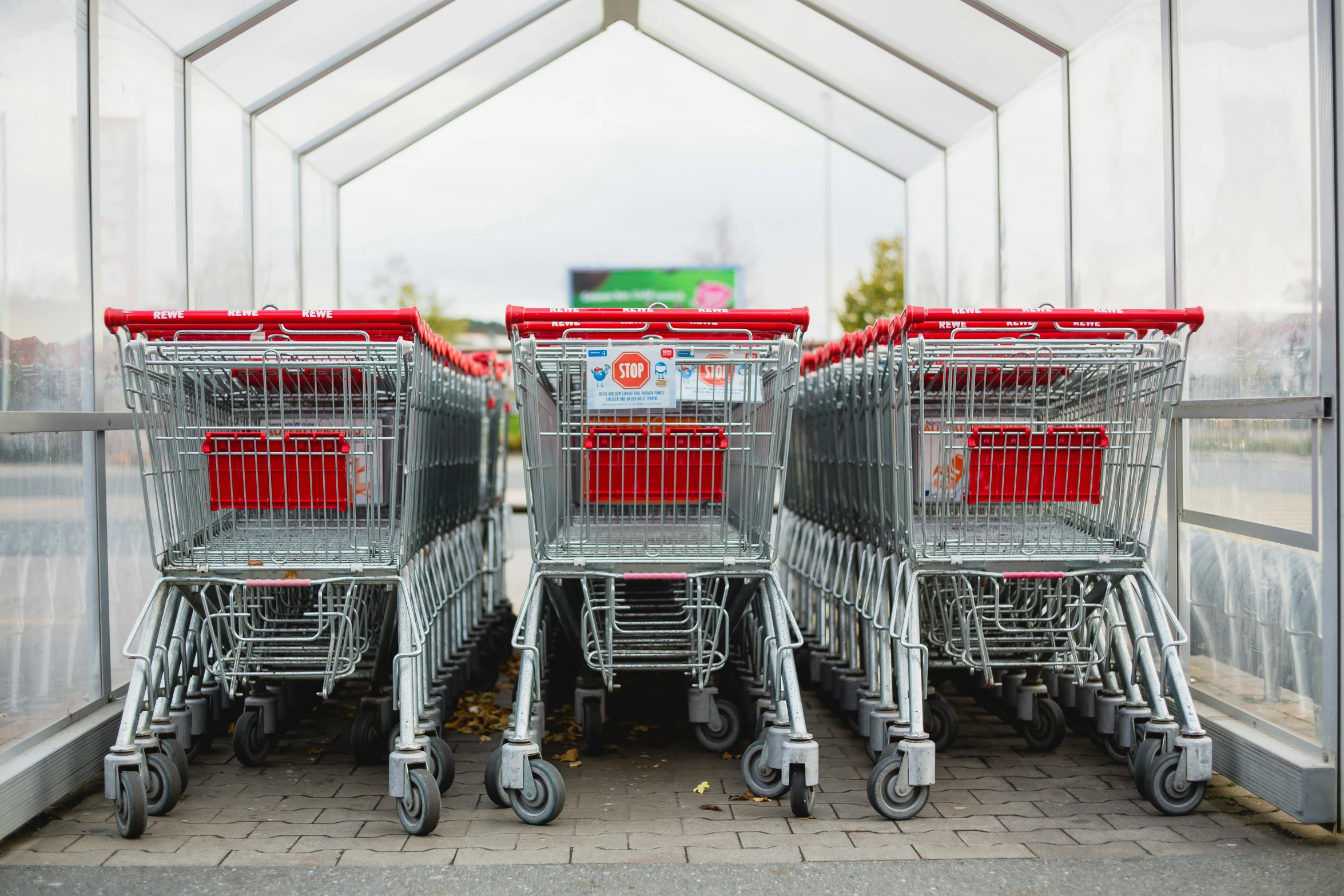 several carts are lined up together in front of the entrance