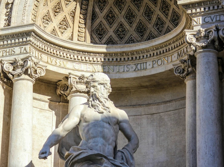 a statue of the god medusan in front of a building