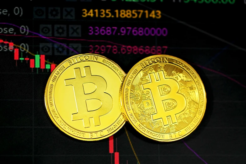 two bitcoins on an image of graph - based stock