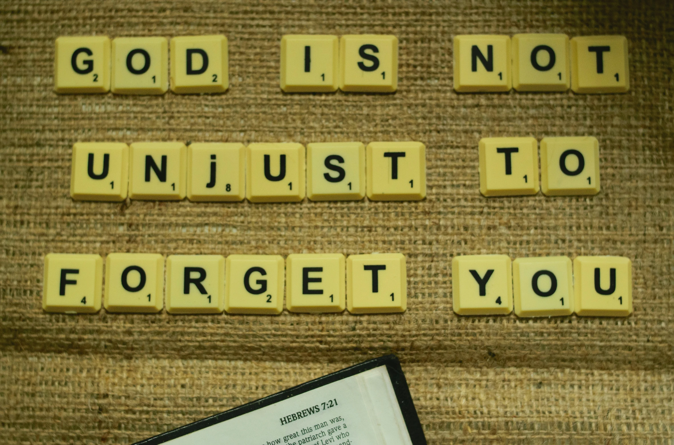 an image of a notepad with scrabbled tiles on it