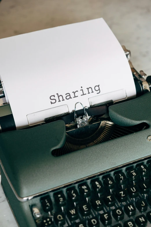 a close up of a typewriter with paper