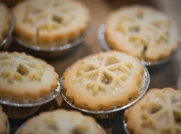 a tray with a pile of tasty looking pies