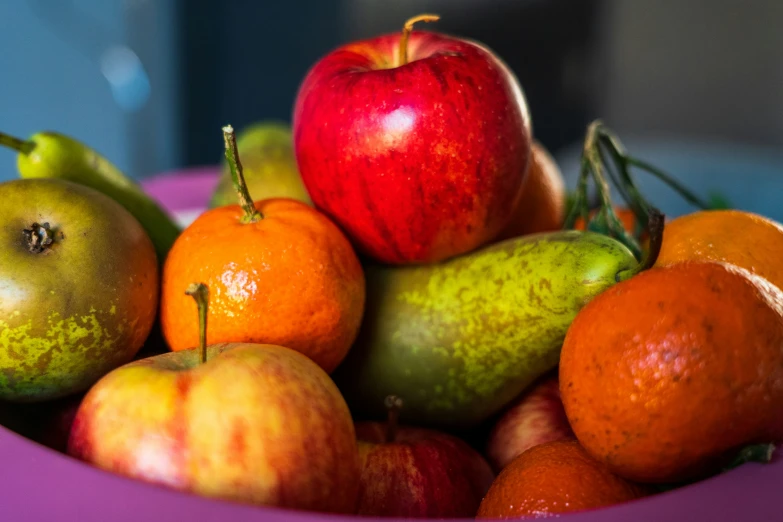 a pile of fruit with an apple in it