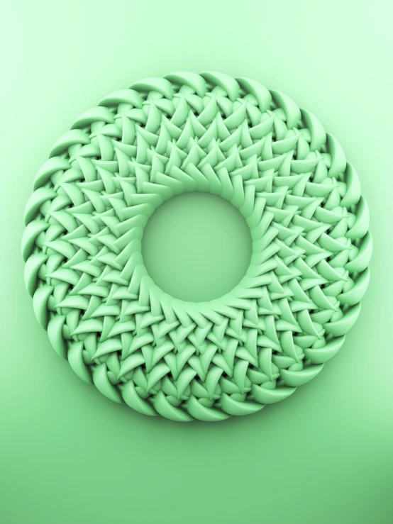 a sculpture with green colored material and an artistic circular shape