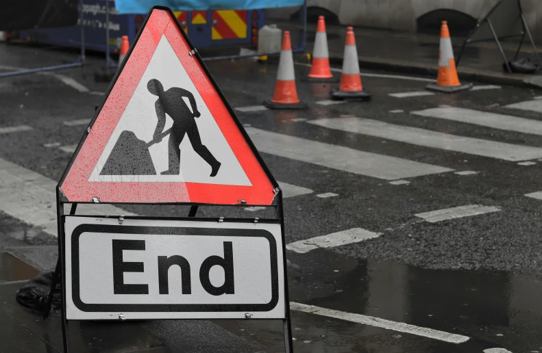 a warning sign on the side of the road