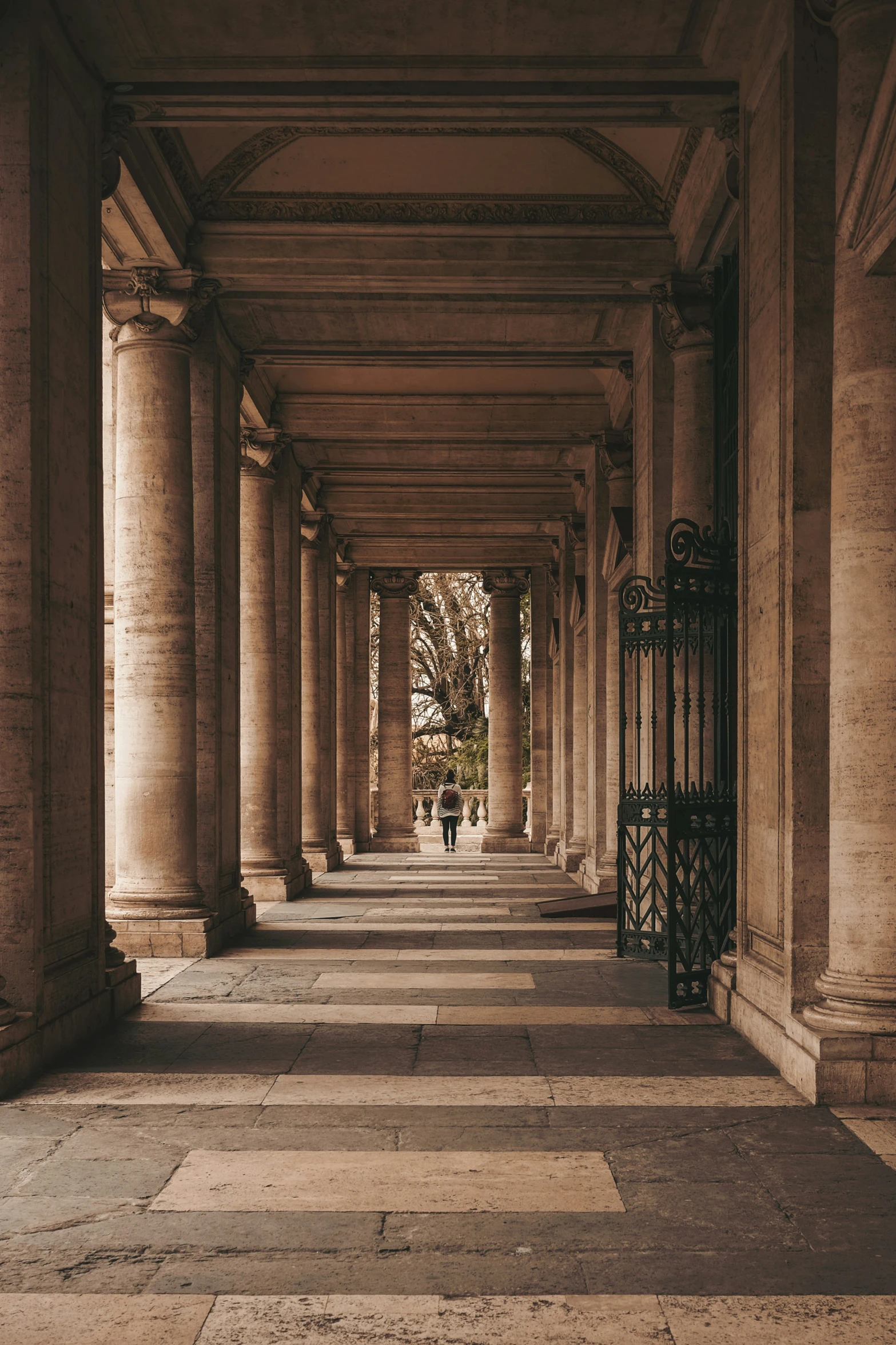 large open hallway with a set of metal gates