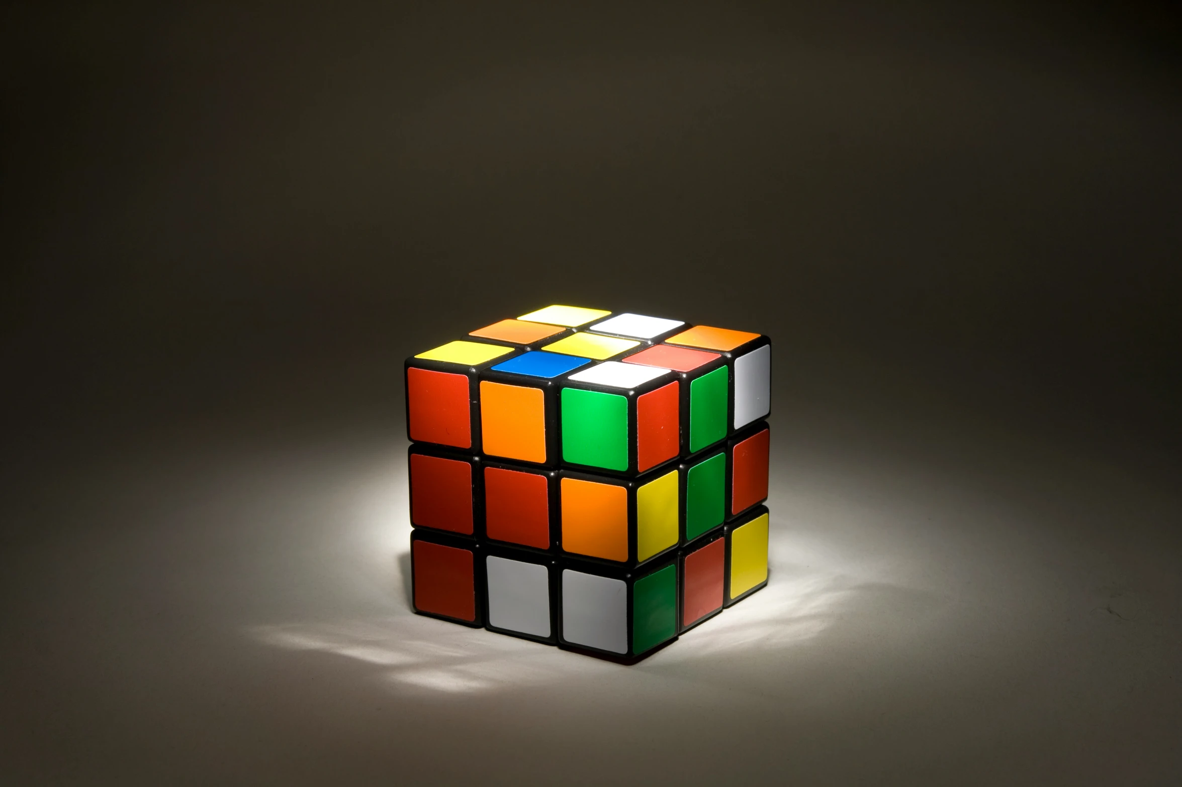 an illuminated rubik cube is shown with the light shining on it