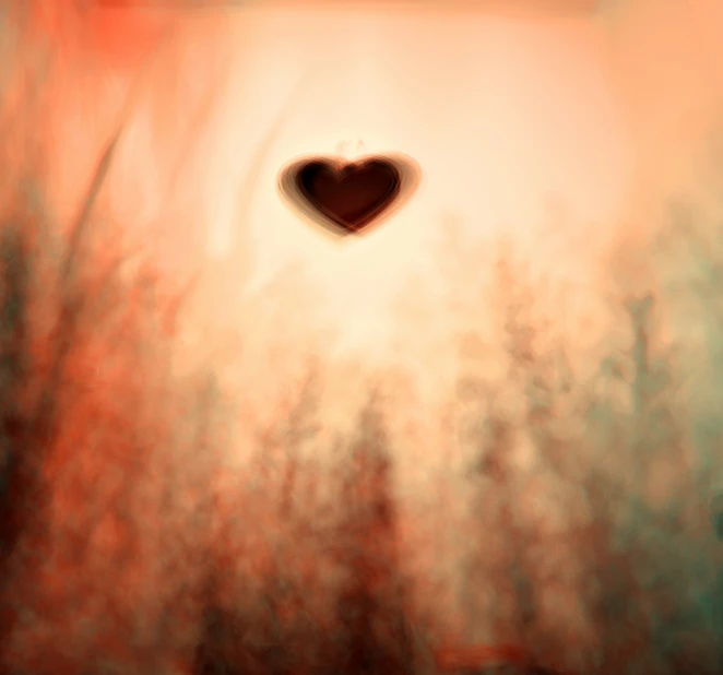 an artistic pograph shows a heart on a blurry background