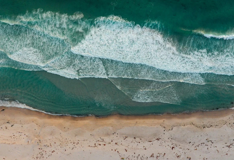 the view of the ocean from above looking down at the shoreline